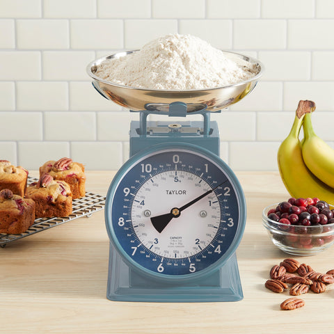 Taylor in kitchen lifestyle scene, complements neutral decor while weighing