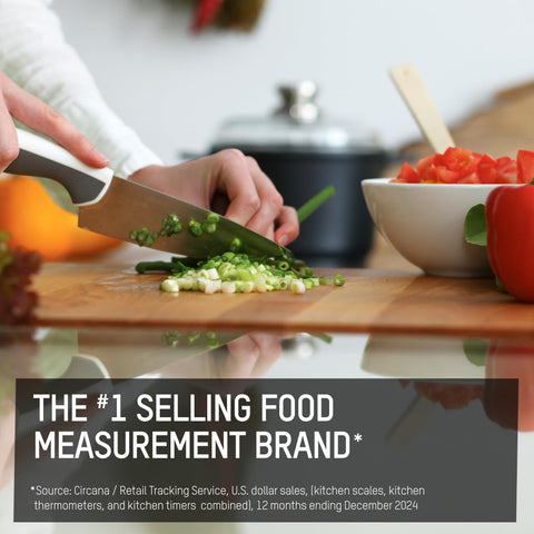 Taylor scale next to utensils to show compact size and countertop fit