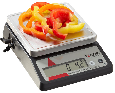 Taylor TE10FT front view showing compact commercial scale and clear display for precise weighing