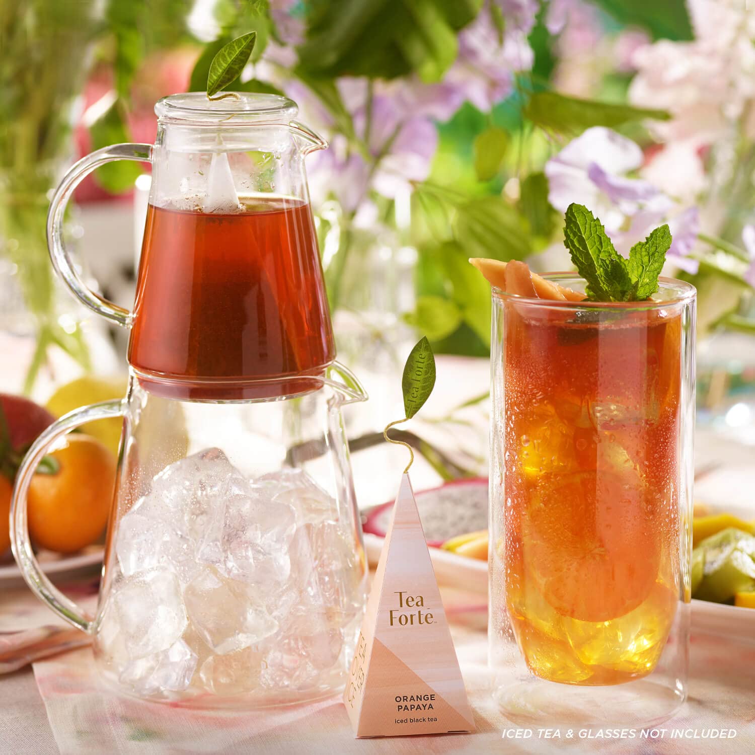 Tea Forte pitchers on outdoor table serving iced tea to guests for effortless entertaining