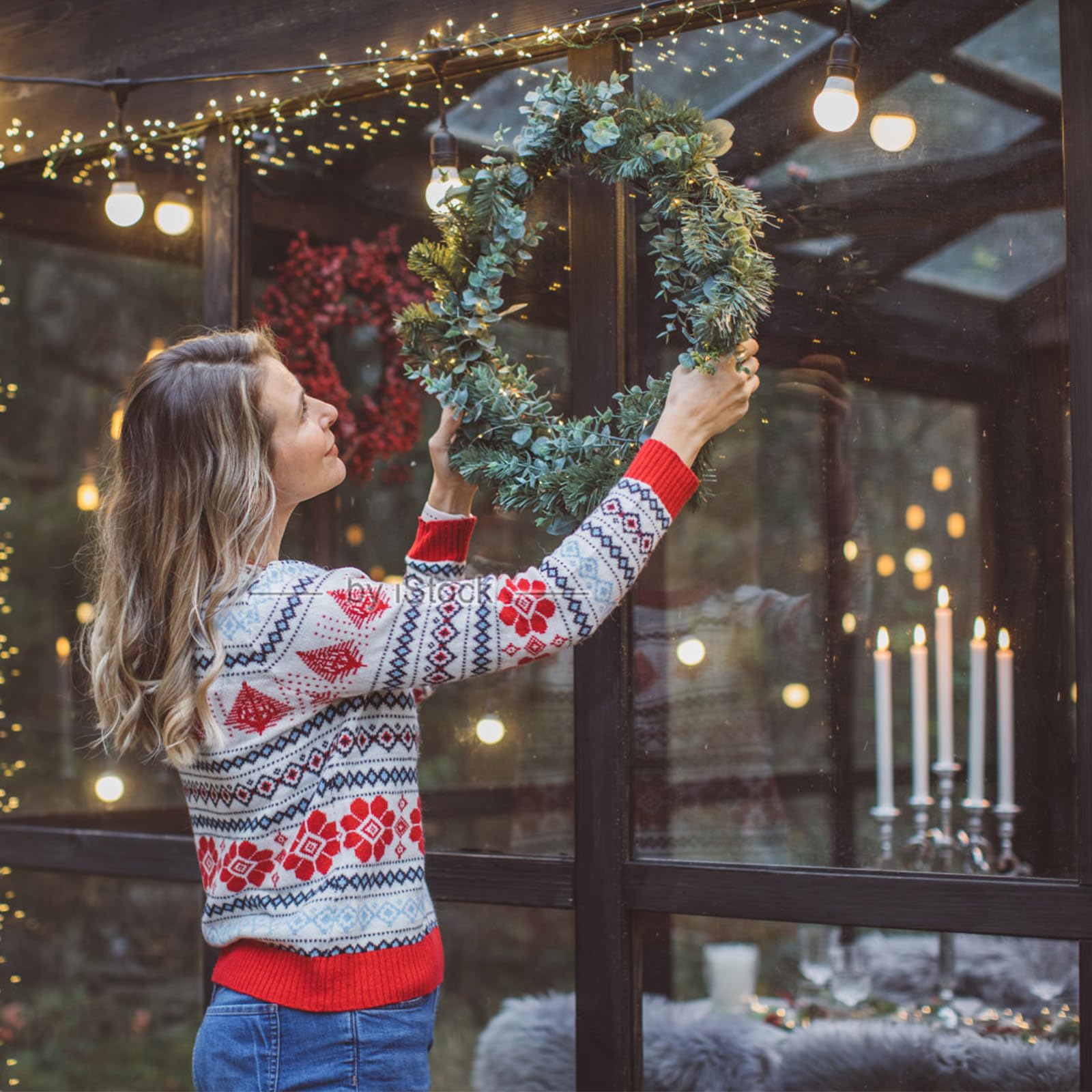 Temfmy wreath held in hand to show 14-inch scale and lightweight convenience
