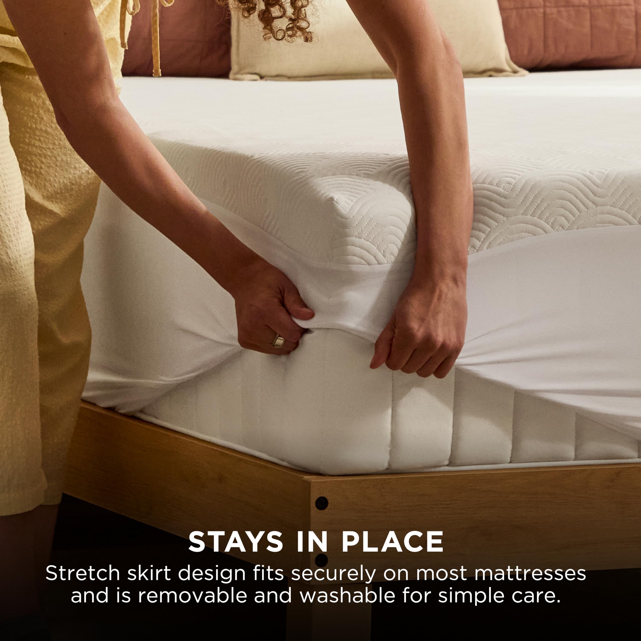 Tempur-Pedic topper being unrolled from packaging showing easy setup benefit