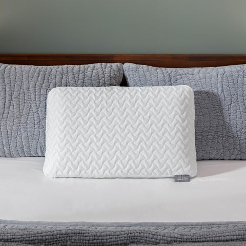 Tempur-Pedic head resting on pillow, demonstrates cradling support and comfort