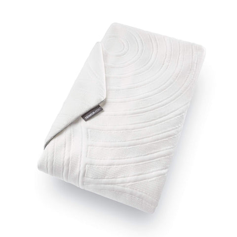 Tempur-Pedic folded protector on laundry counter showing easy care