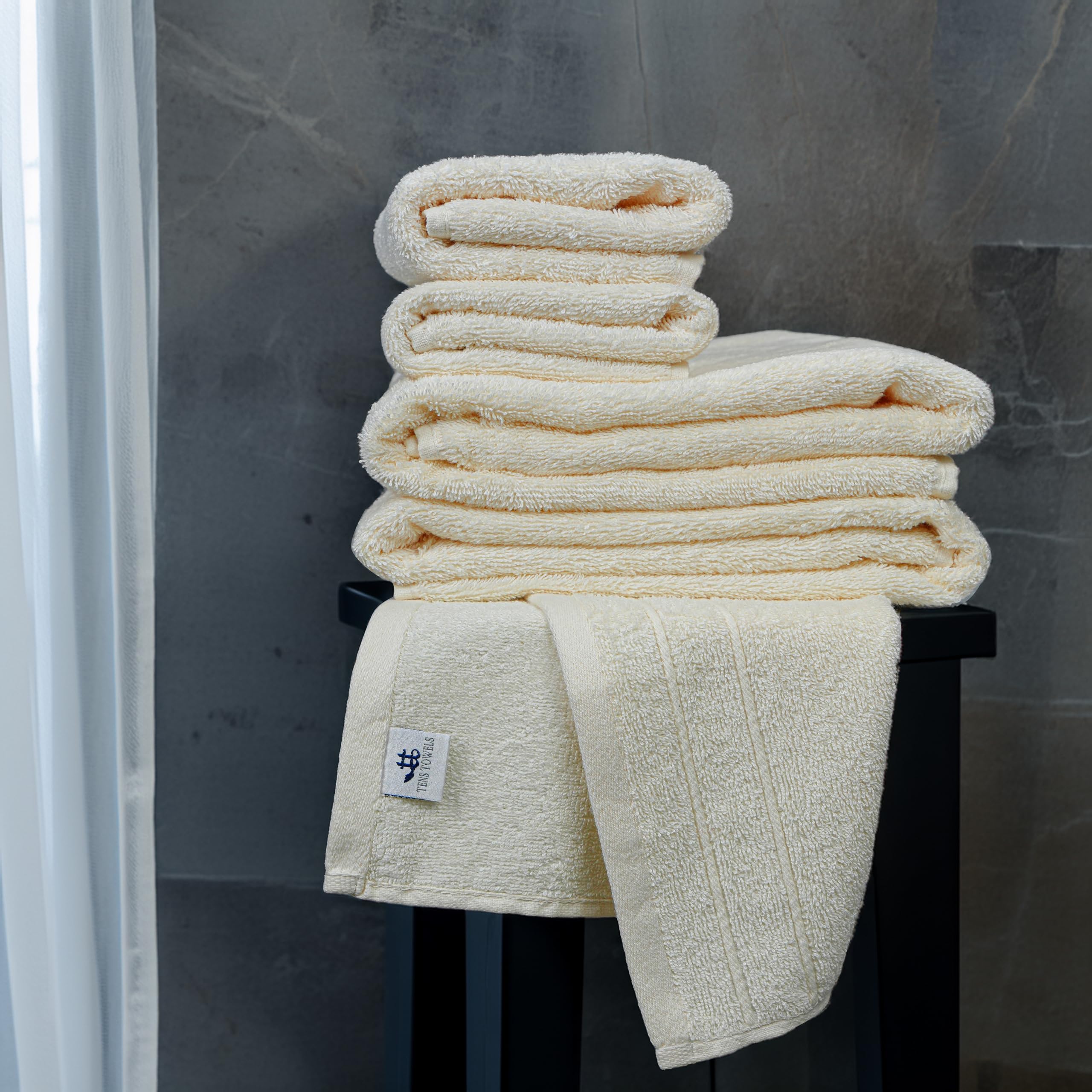 Tens Towels styled in a bathroom to show how cream coordinates with decor