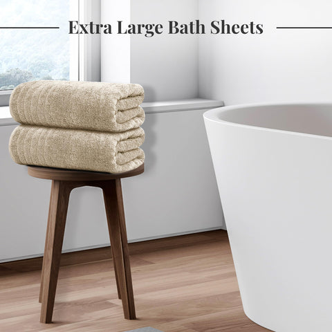 Tens Towels draped on a towel rail in a bathroom, showing quick-drying and style