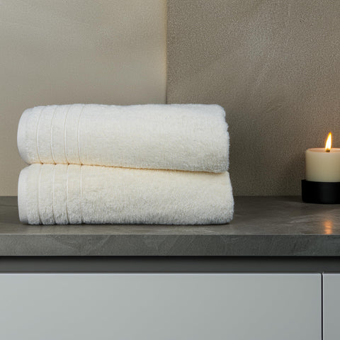 Tens Towels folded stack on shelf showing compact storage benefit