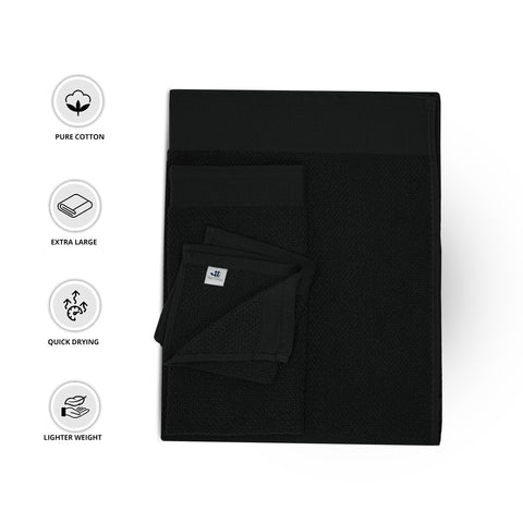 Tens Towels arranged in modern bathroom to show coordinated décor and luxury feel