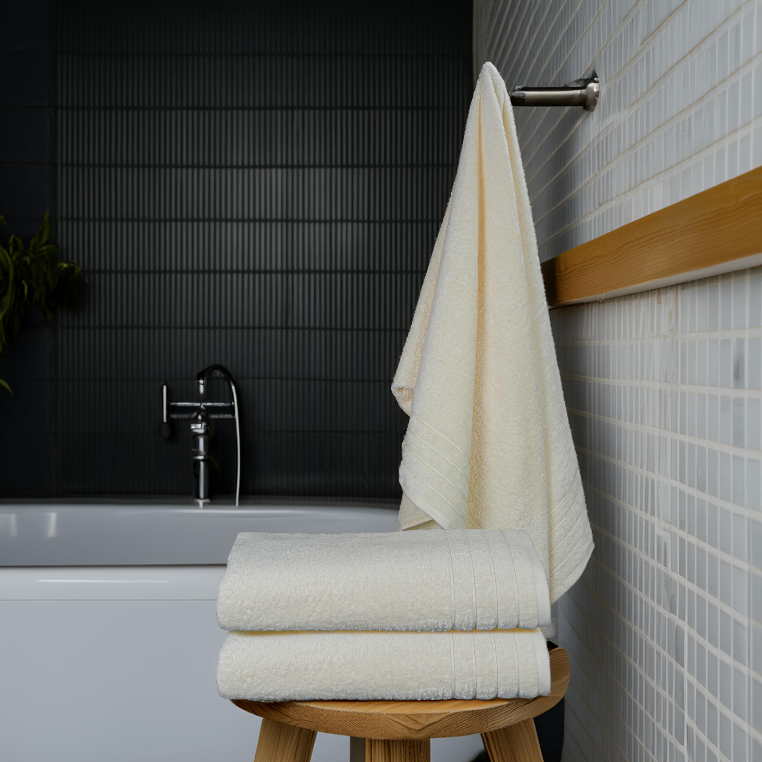 Tens Towels beside ruler showing 30x60 inch size for generous coverage benefit