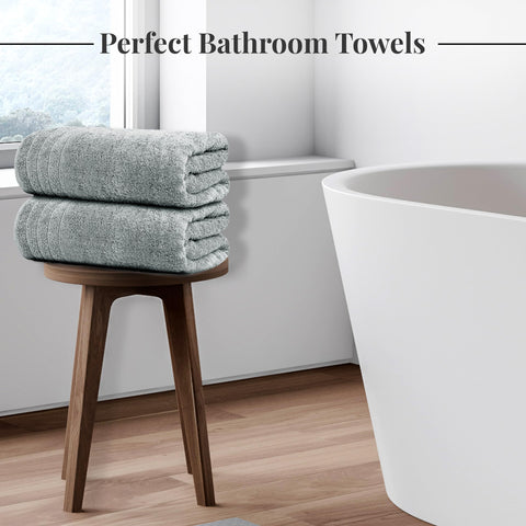 Tens Towels next to ruler showing 30 x 60 inch oversized dimensions