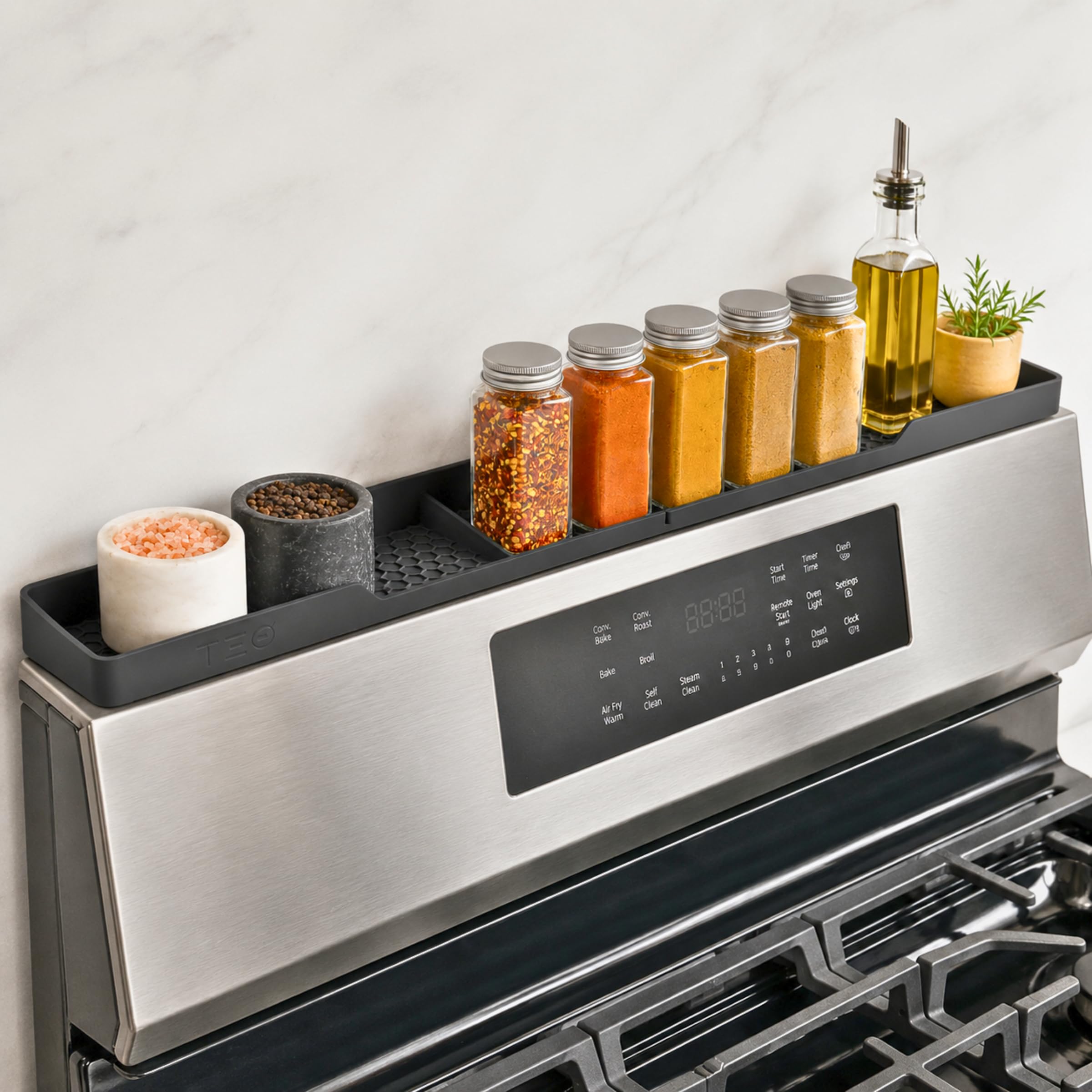 TEO front view of magnetic silicone stove top shelf shows organized spices benefit quick access
