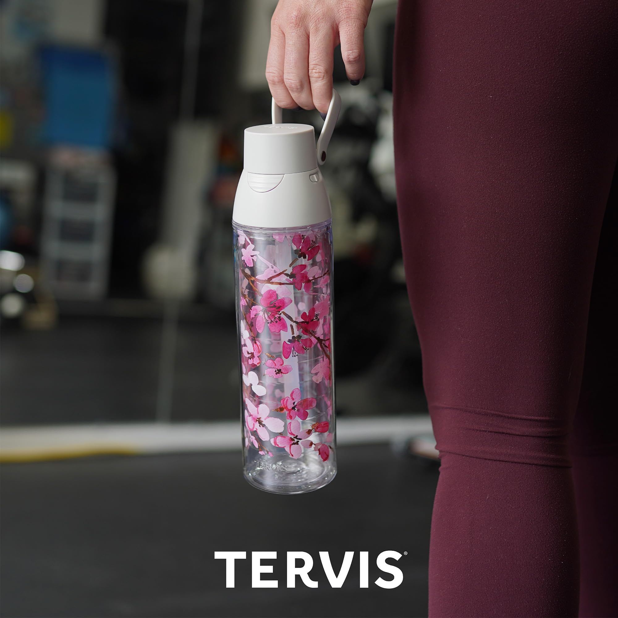 Tervis Sakura seated in car cup holder for secure travel convenience