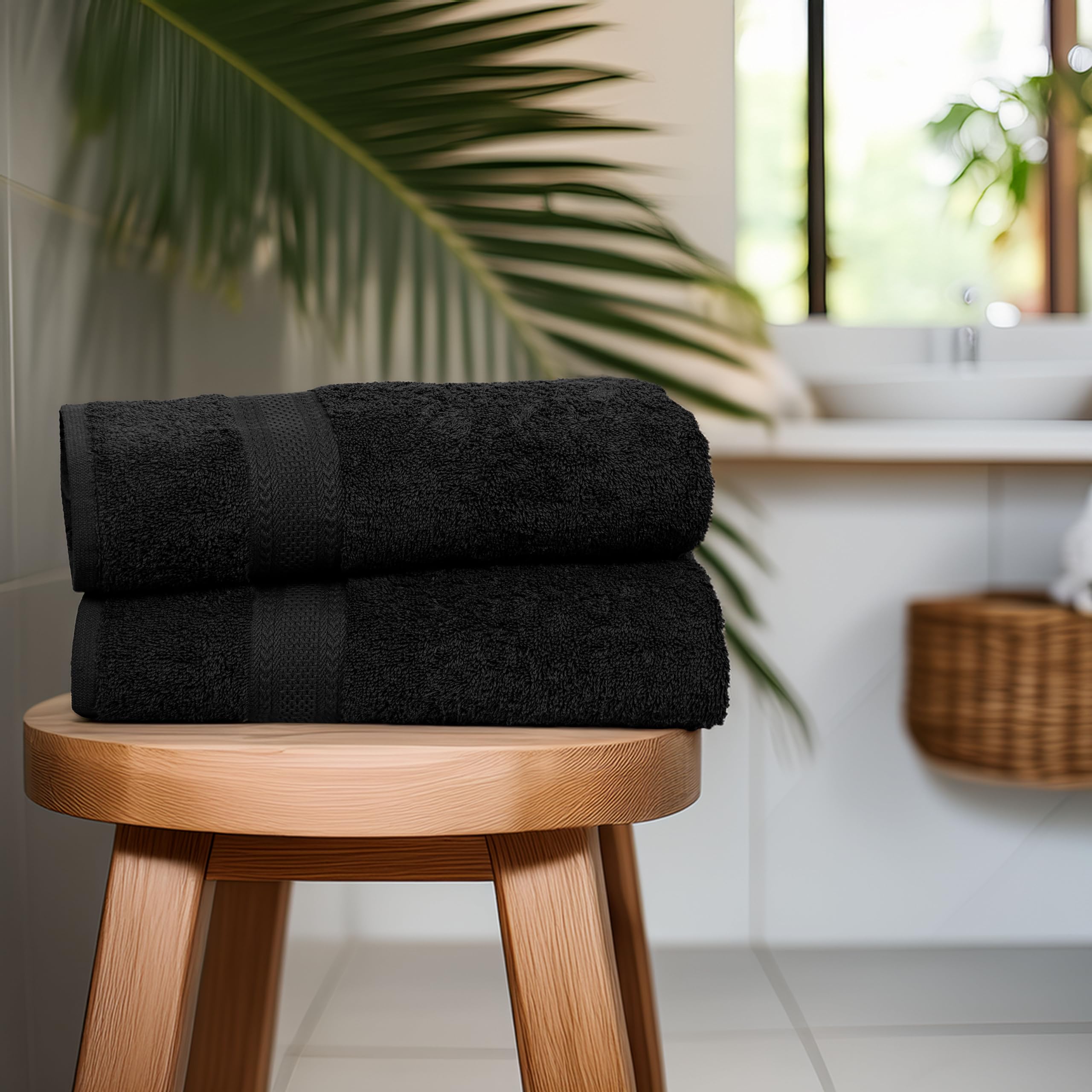 TEXCRAFT towel beside hand showing 24x50 size and coverage