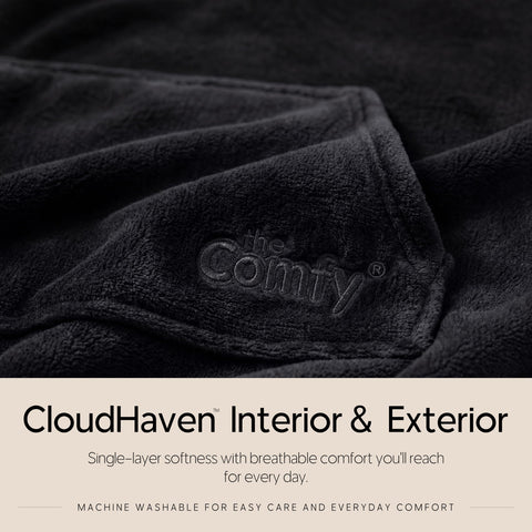 THE COMFY Dream worn on couch lifestyle scene showing hands-free movement