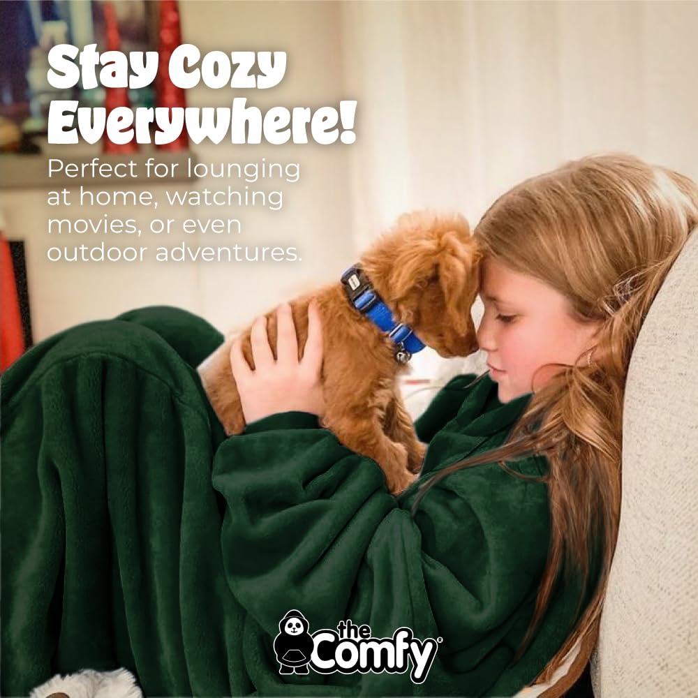 Child wearing THE COMFY Dream Jr on couch enjoying hands-free comfort