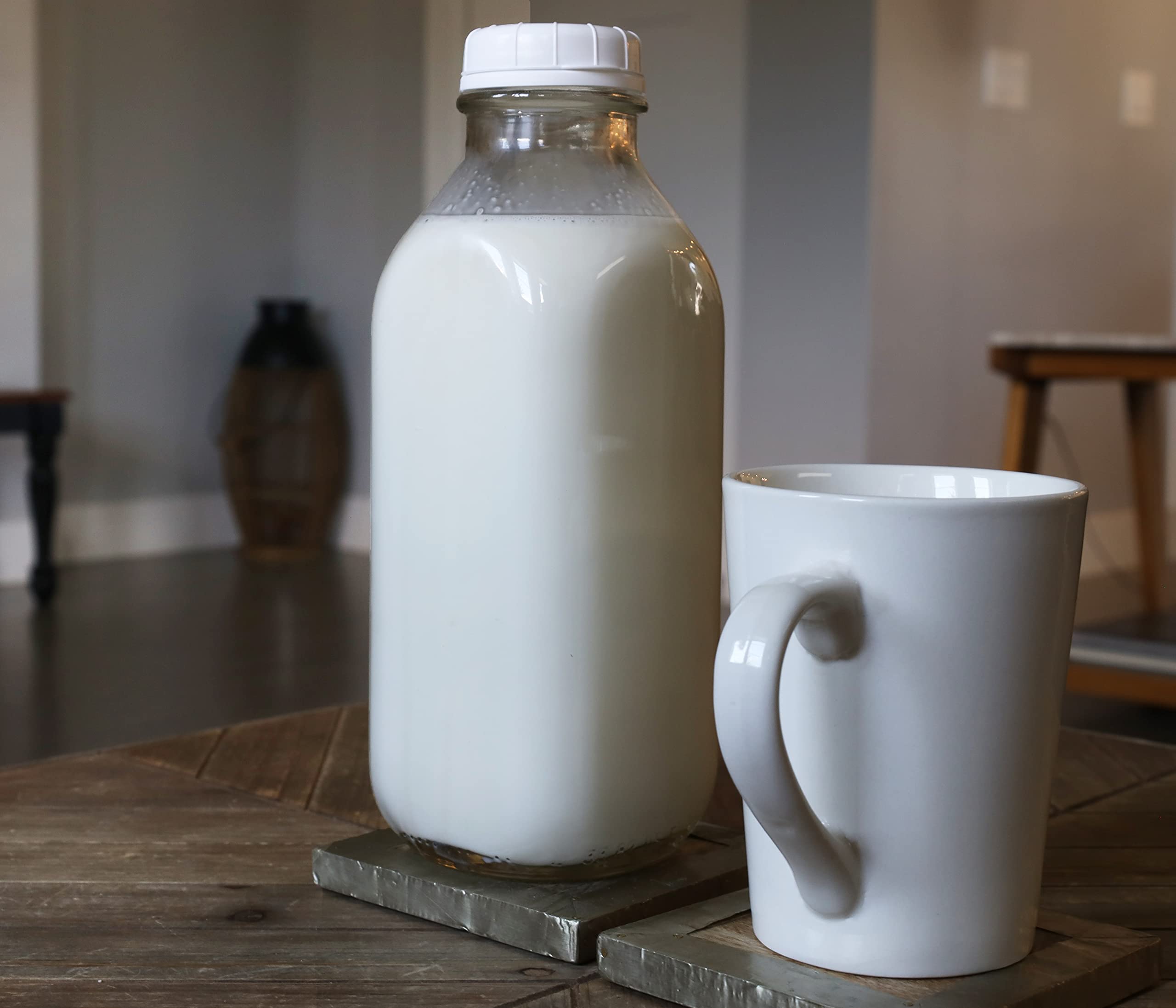 The Dairy Shoppe pouring maple syrup from bottle onto pancake for neat, precise serving