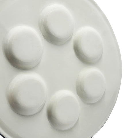 The Dreidel Company plate in use on a Passover table illustrating organized ritual foods and elegant ambiance