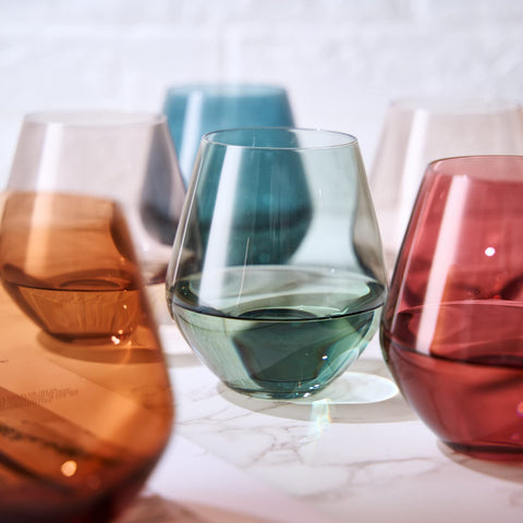 The Wine Savant Khen glass held with red wine, showcasing aroma-friendly bowl shape