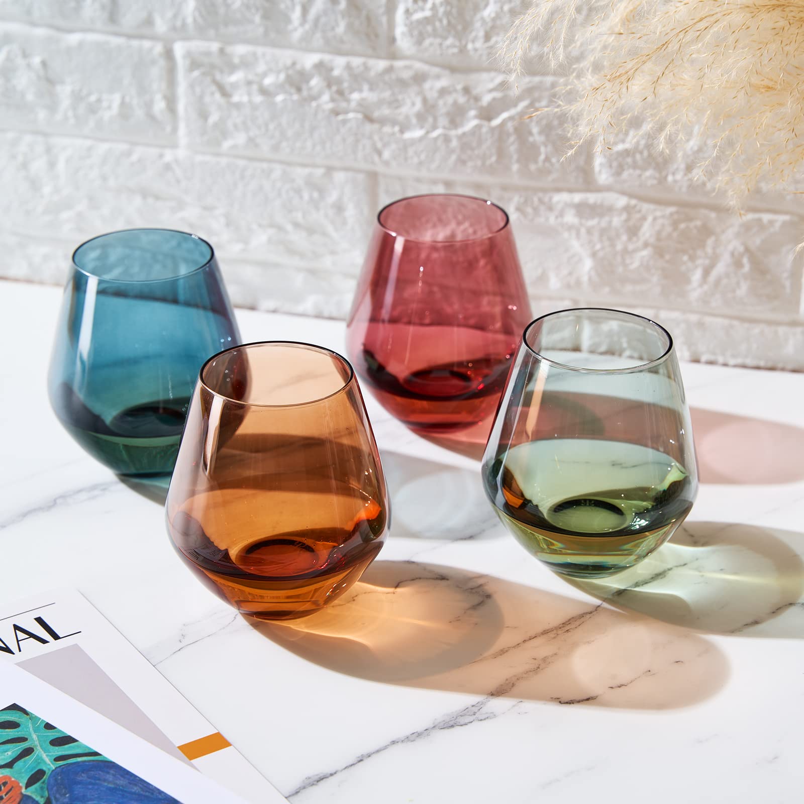 The Wine Savant Khen glass beside a hand for scale, demonstrates comfortable 16oz capacity