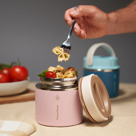 ThermoFlask jar being carried by its handle highlighting comfortable portability