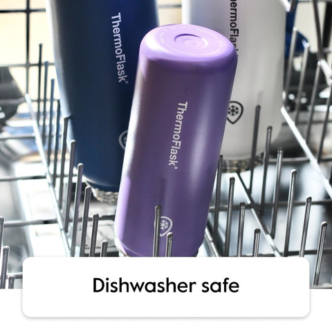 ThermoFlask straw lid being used hands-free showing convenient sipping benefit