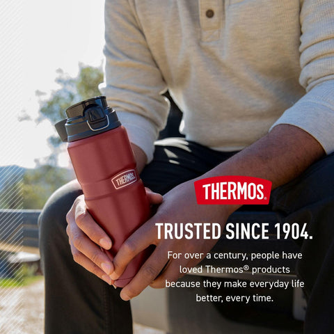 THERMOS hand holding bottle while sipping showing one-handed use convenience benefit