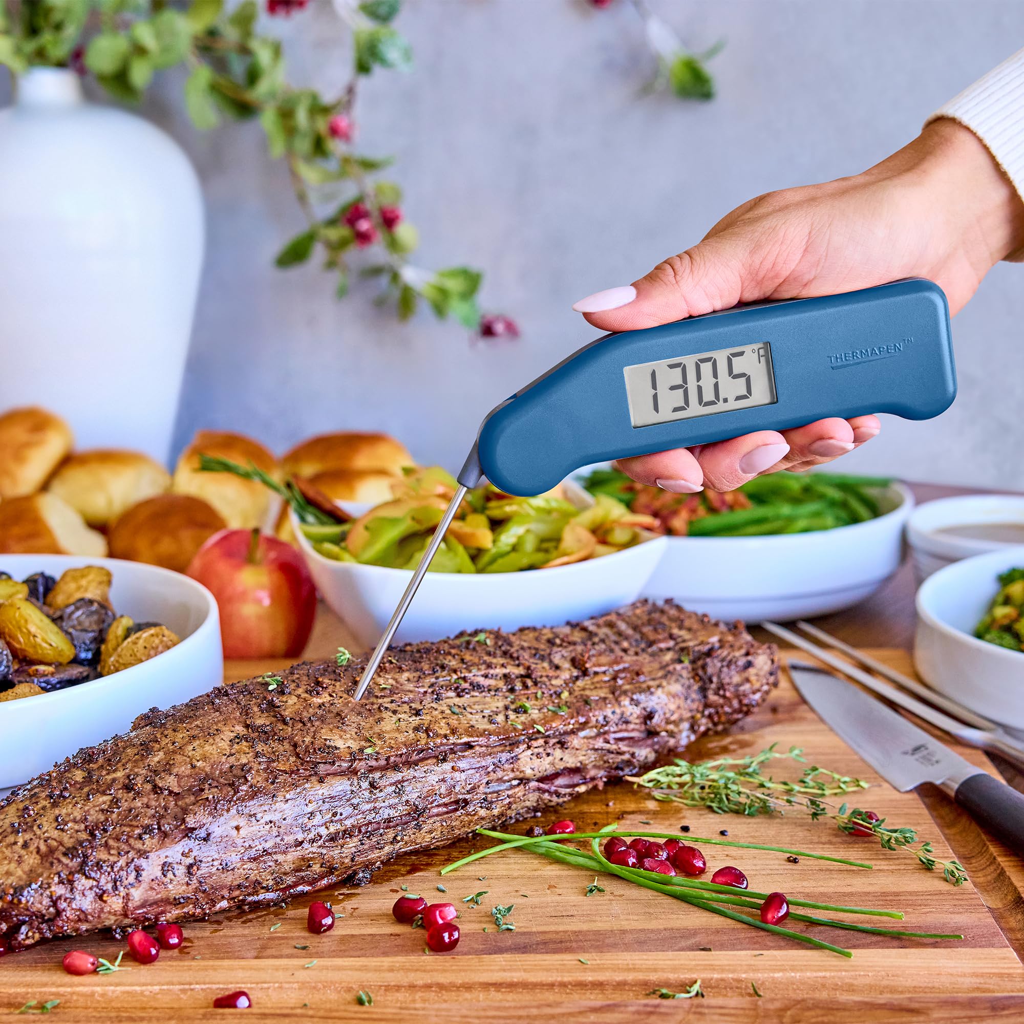 ThermoWorks Classic Thermapen in use on a grill demonstrating quick temperature checks for better results