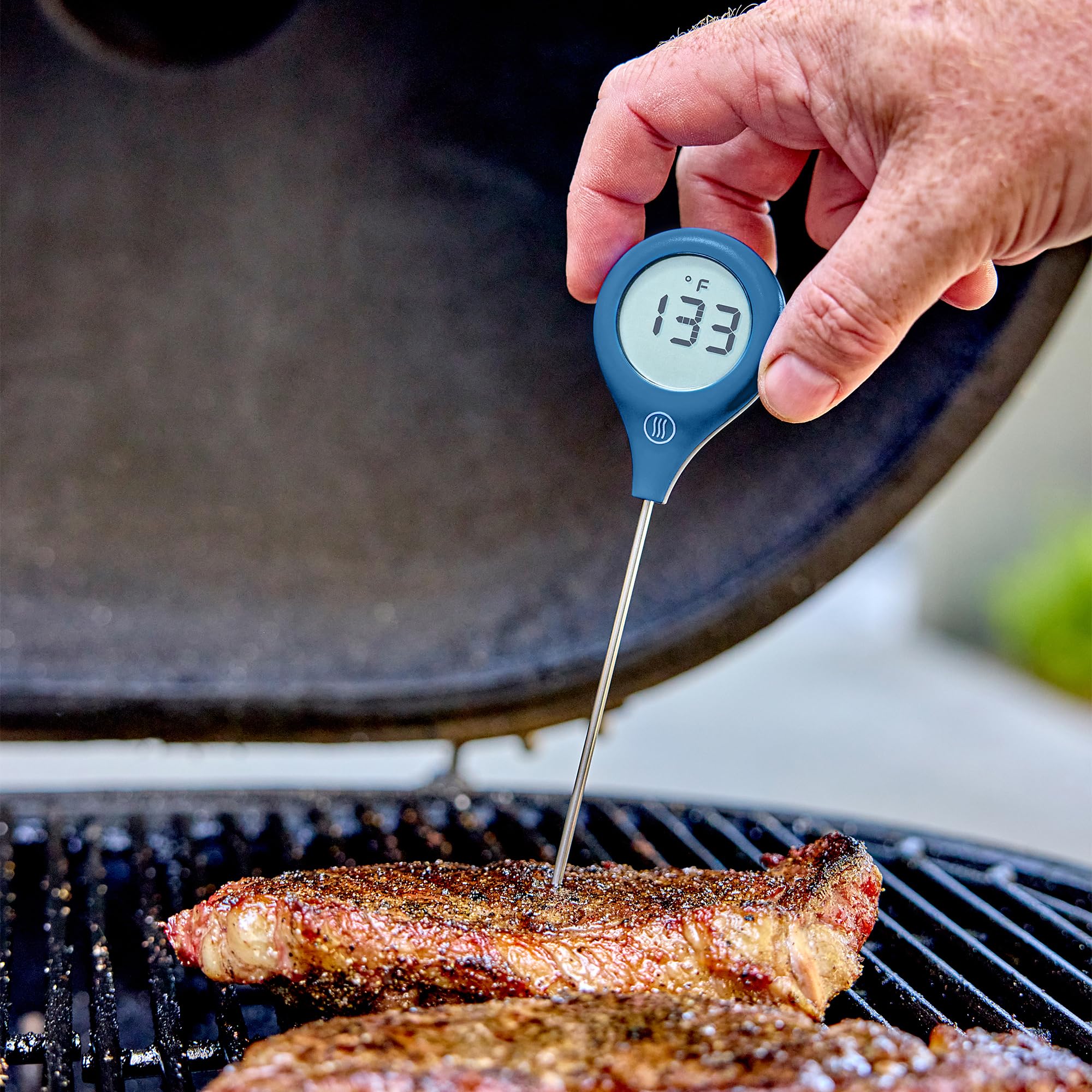 ThermoWorks ThermoPop 2 in kitchen lifestyle shot showing quick temperature checks while cooking