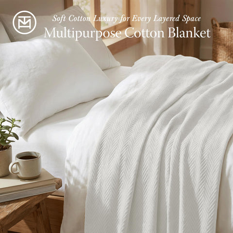 Threadmill blanket spread across a king bed creating layered, serene bedroom styling