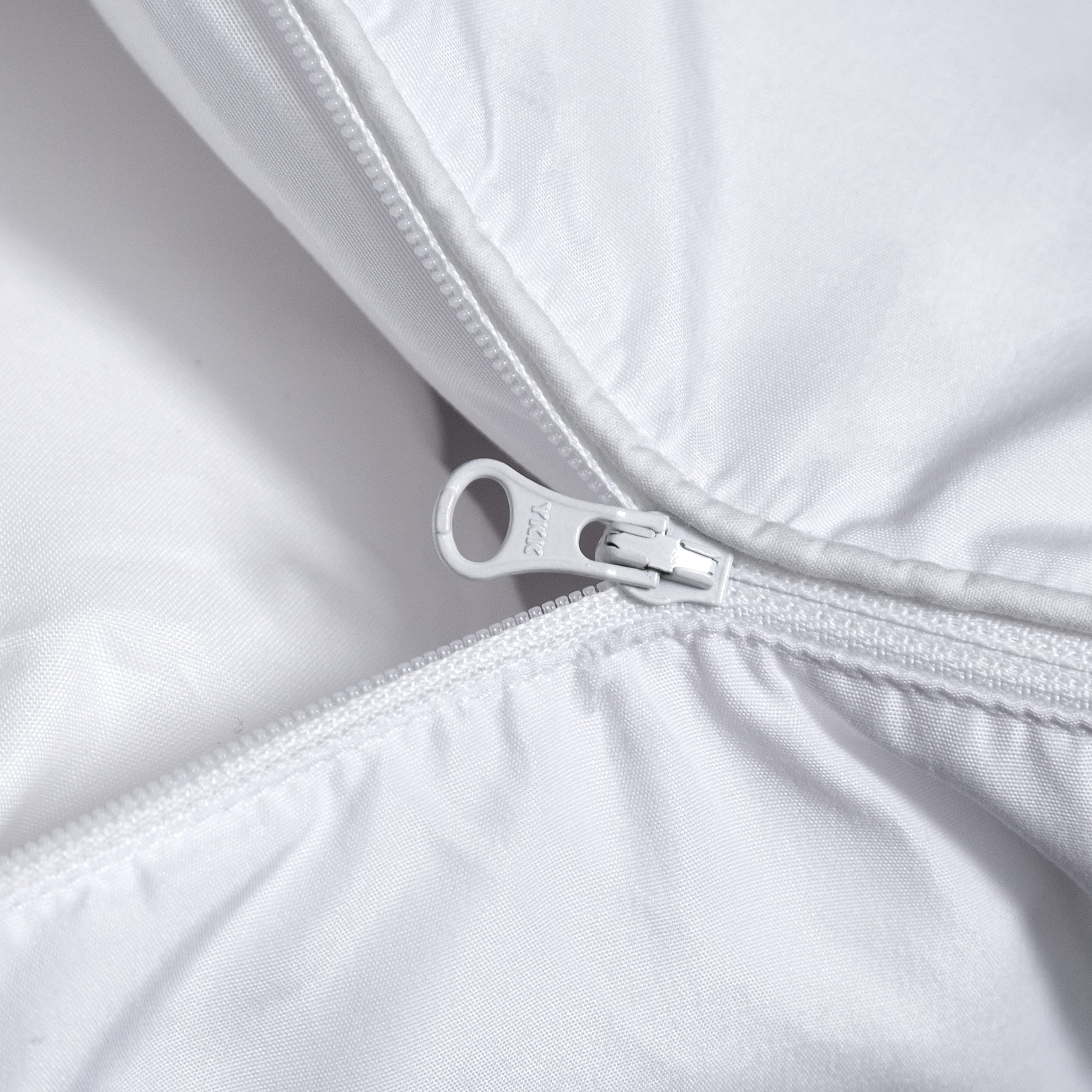 Three Geese pillow on a made bed demonstrating customizable loft and restful positioning