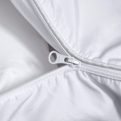 Three Geese pillow on a made bed demonstrating customizable loft and restful positioning