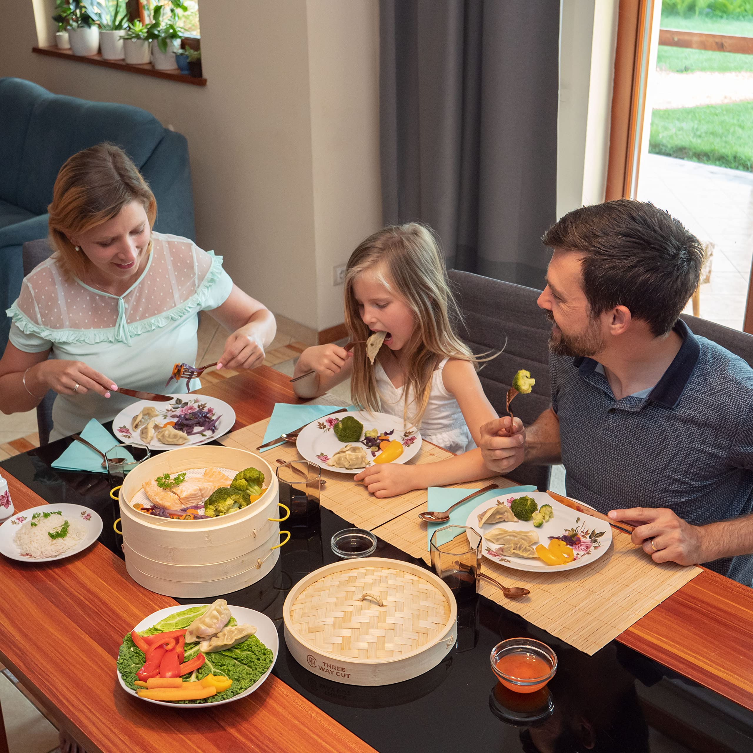 Three Way Cut bamboo steamer on table with dim sum showing restaurant-style results at home