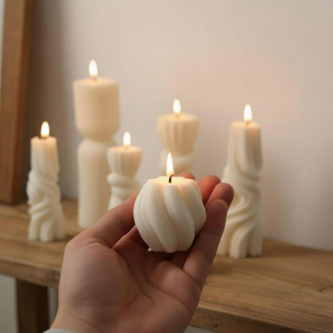 Threlaco group of candles staged for scale illustrating size variety for layered displays