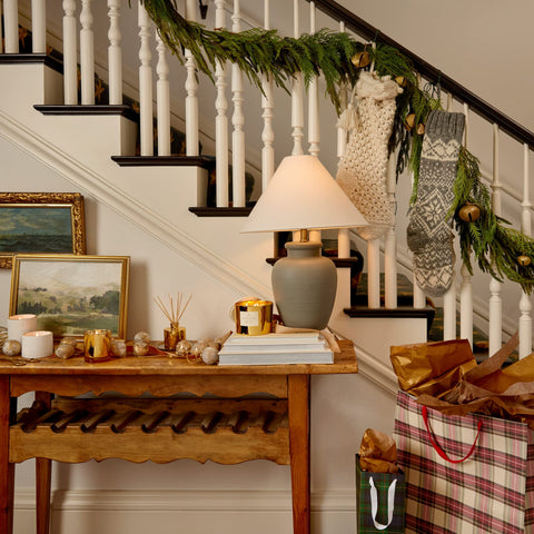 Thymes Frasier Fir gift wrapped on tabletop illustrating ready-to-give luxury presentation