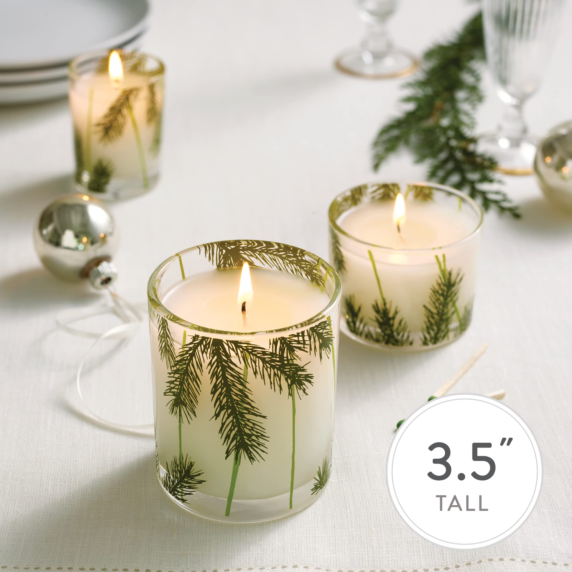 Thymes Frasier Fir candle lit in living room creating cozy ambience benefit
