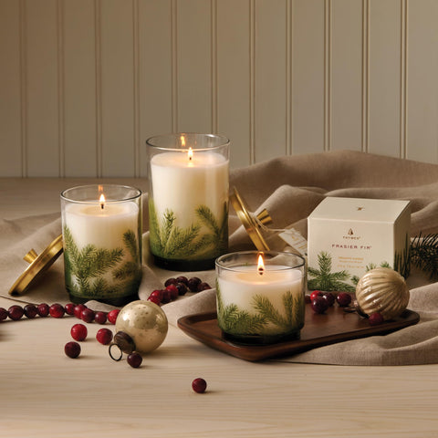 Thymes Frasier Fir beside a mug to show small 7.5 oz scale and convenience
