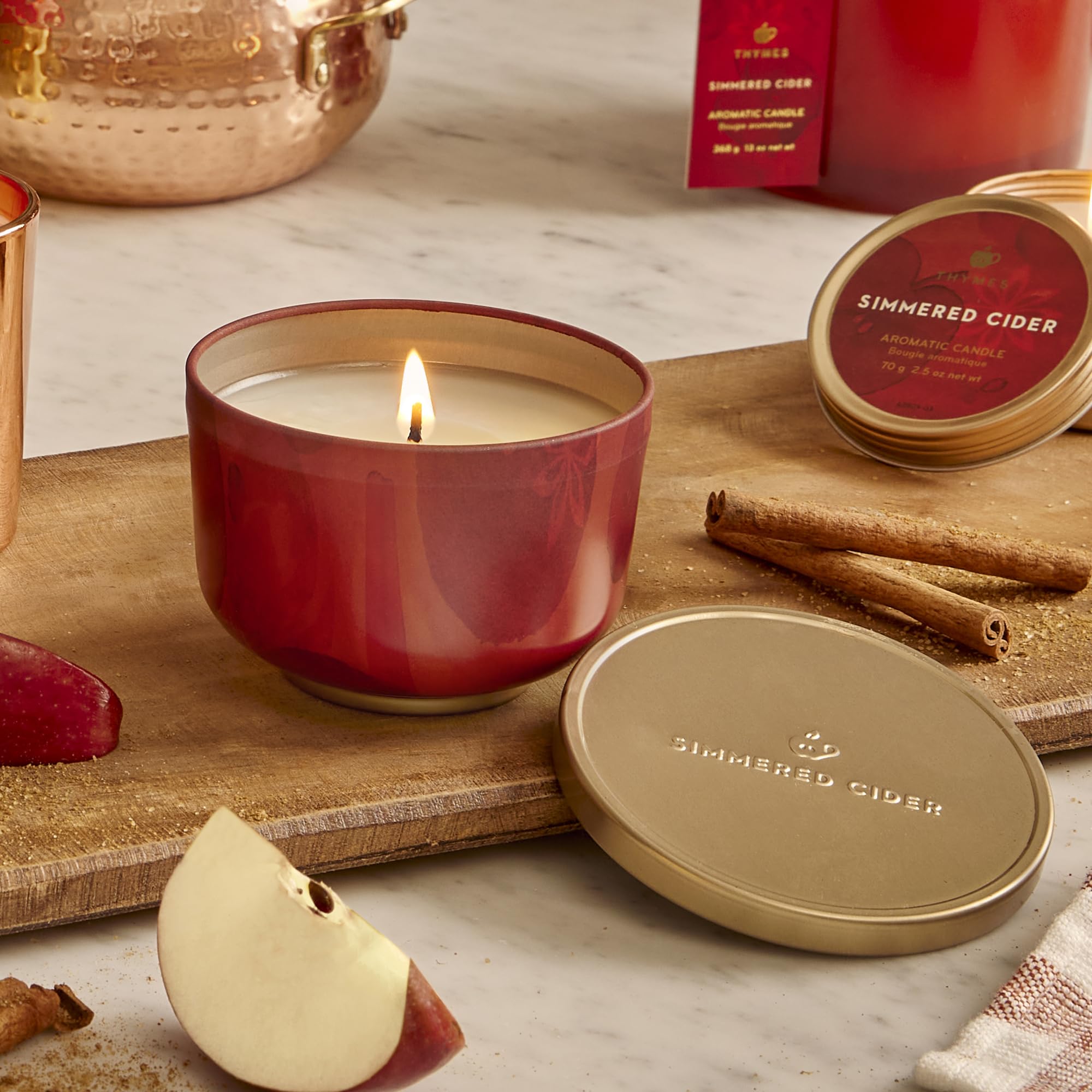 Thymes gold lid closeup highlighting secure seal and travel-friendly design