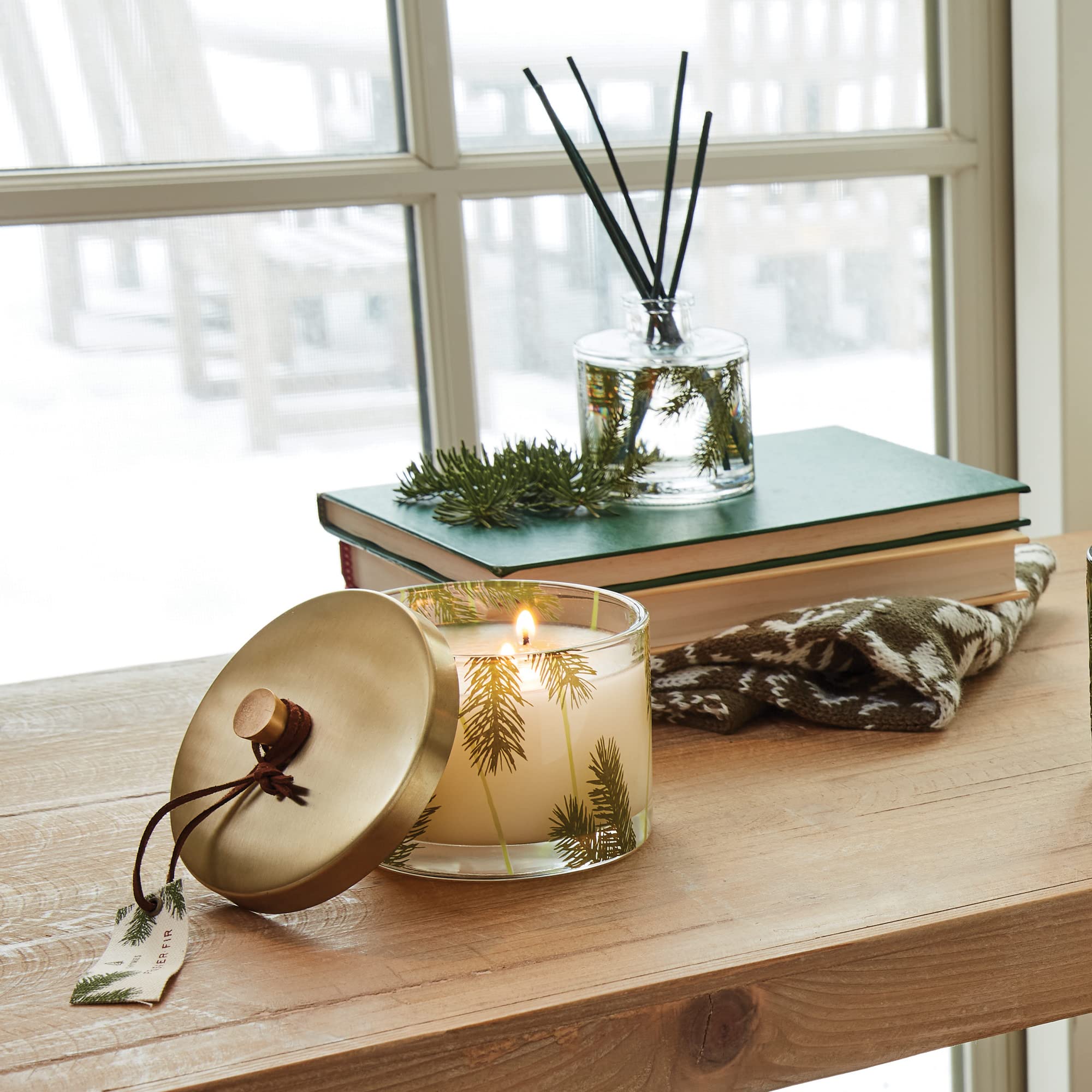 Thymes gold lid detail highlighting decorative finish and keepsake appeal