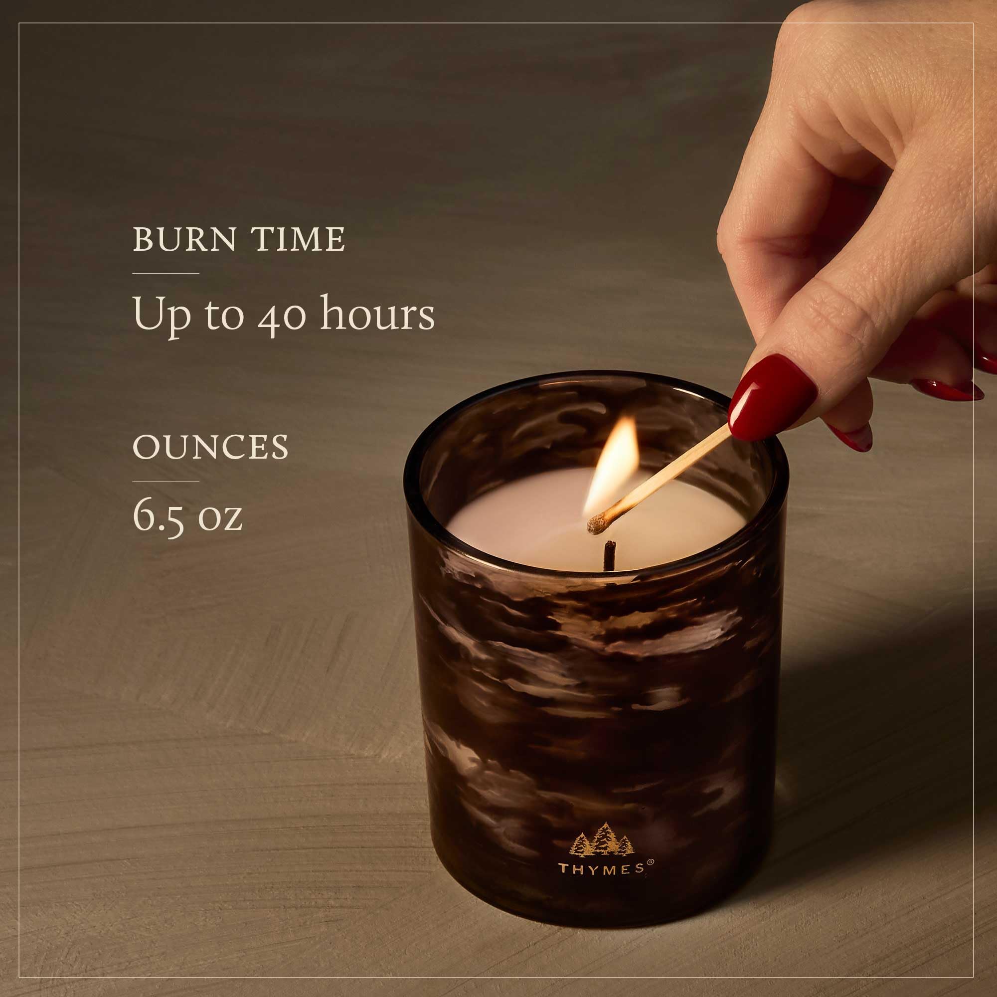 Thymes Noir Woods melted wax pool detail showing even burn and fragrance release