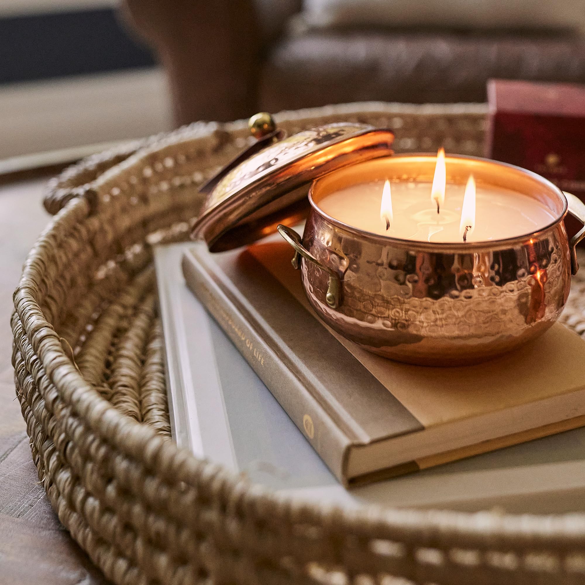 Thymes candle on wooden table lifestyle scene creating cozy autumn ambiance