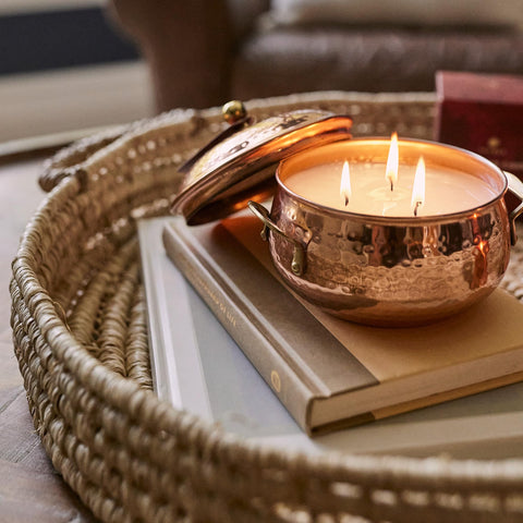 Thymes candle on wooden table lifestyle scene creating cozy autumn ambiance