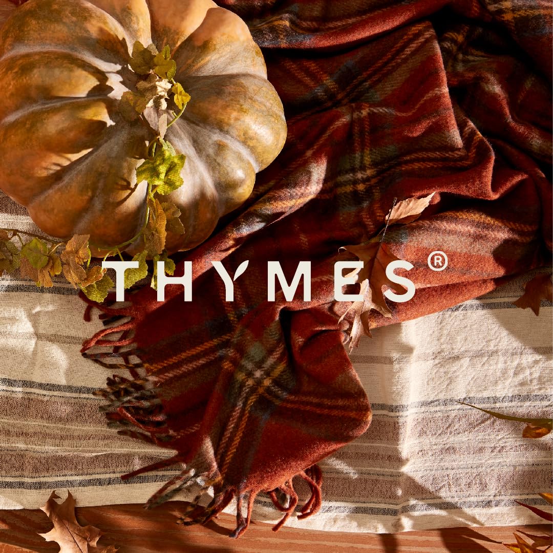 thymes candle burning with even melt pool improving fragrance throw
