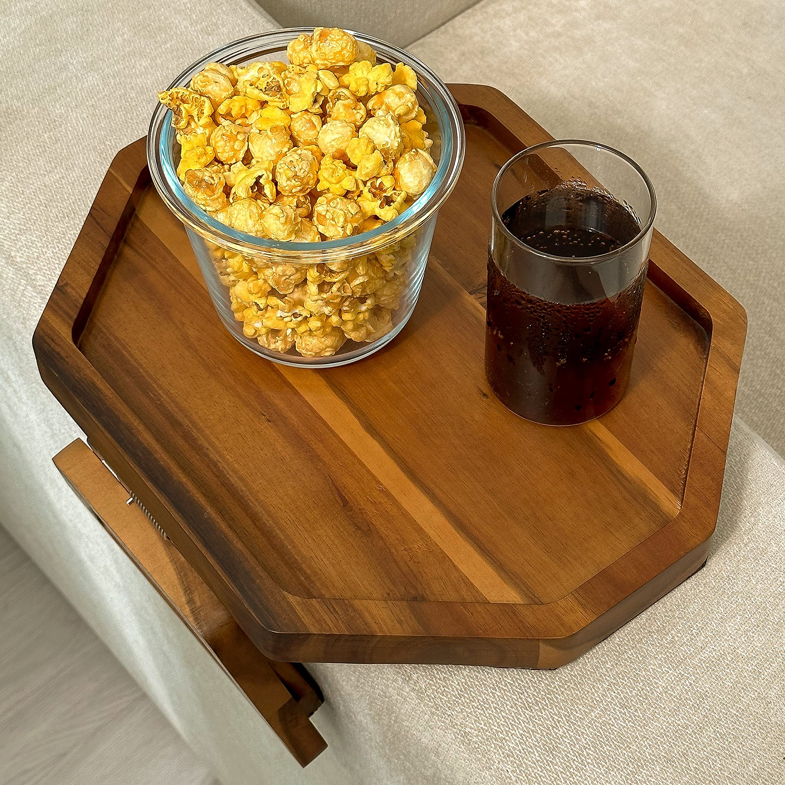 Tinamo tray in use holding a drink and remote offering convenient couch organization