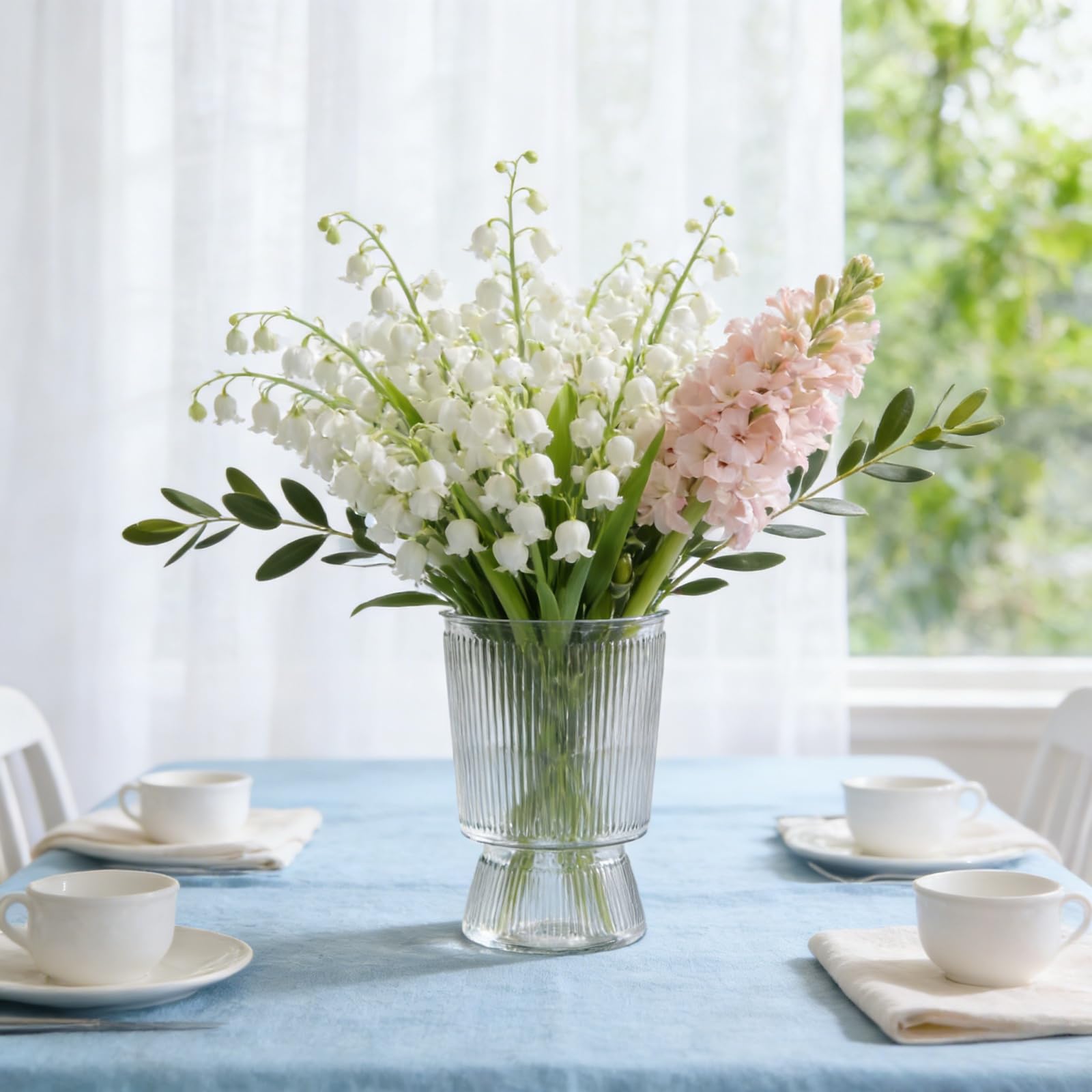 Tlence wedding reception display with multiple vases showing consistent elegant decor