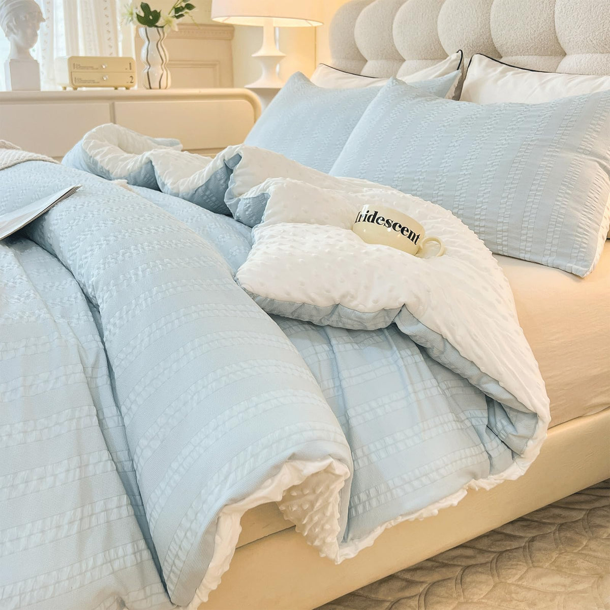 tohrisa comforter front view showing striped seersucker and neat drape for stylish bedding