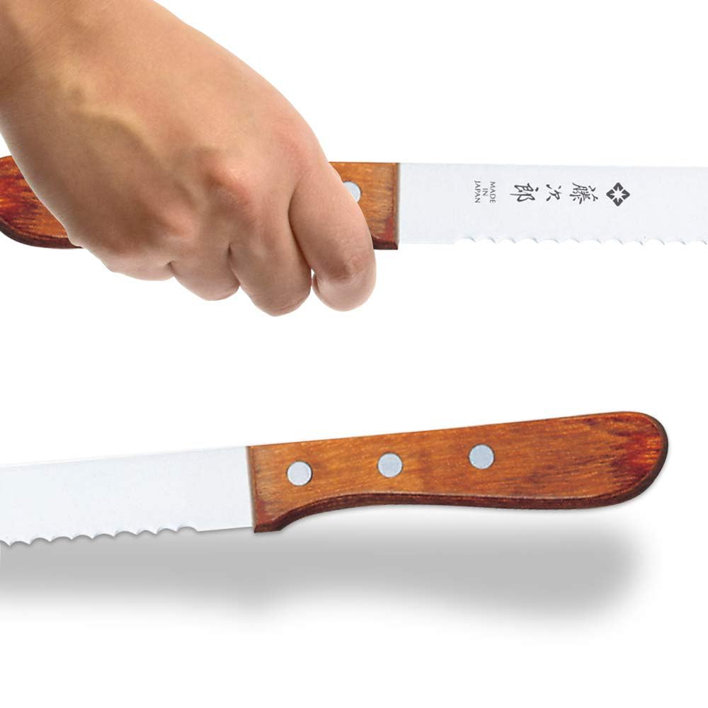 Tojiro closeup of serrated stainless blade edge highlighting durable sharpness