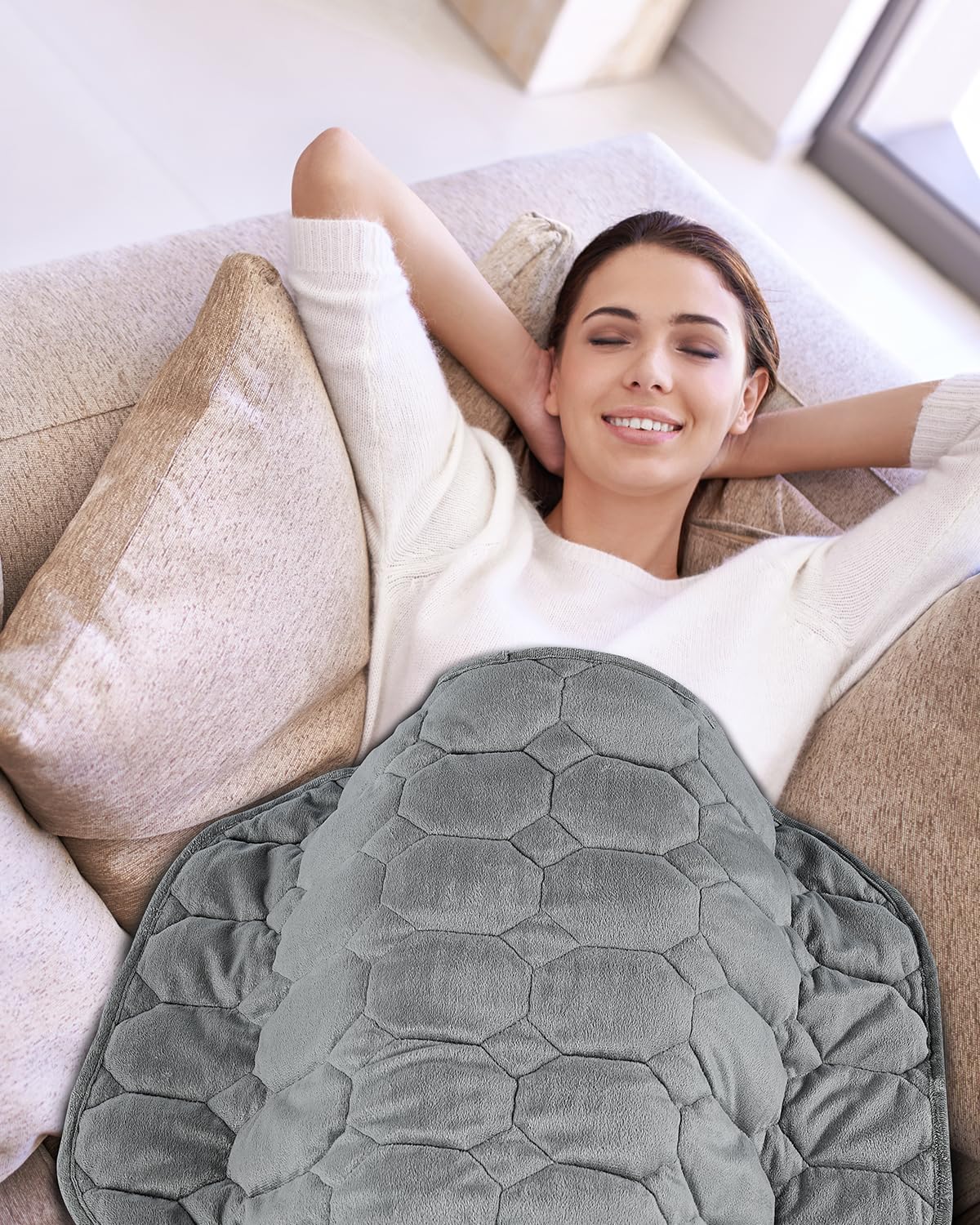 Topblan lifestyle image on couch demonstrating relaxation and warmth
