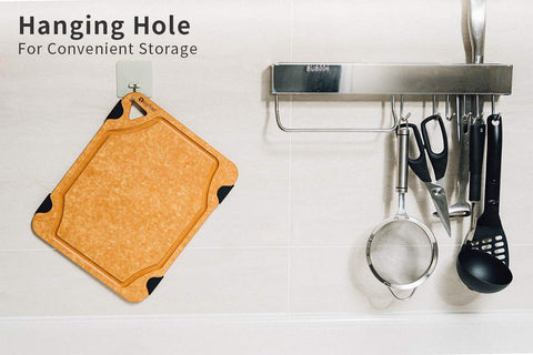 Toptier board next to utensils for size scale, showing large 17.5x13-inch prep area