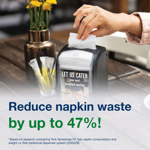 Tork Xpressnap on a table with diner using napkin showing practical benefit