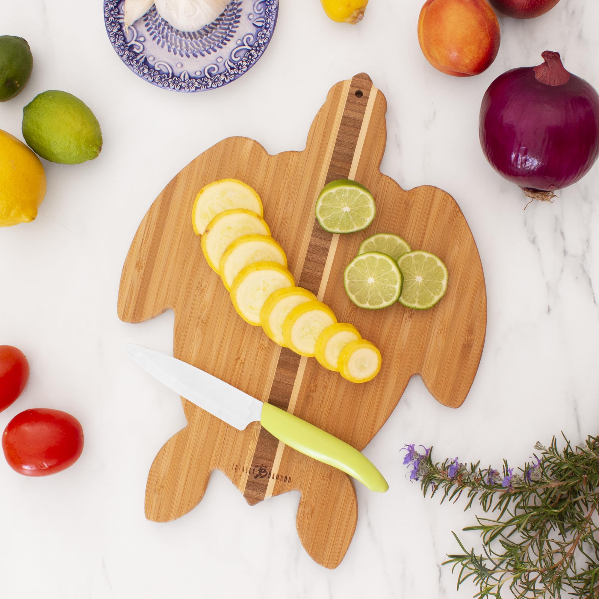 Totally Bamboo board arranged with cheeses and fruit demonstrating serving use